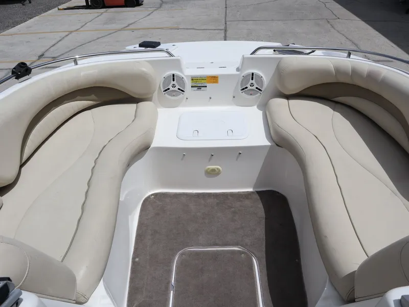 Slide: The Image of Interior view of a 2008 NauticStar 210 DC boat with beige seating. - 17