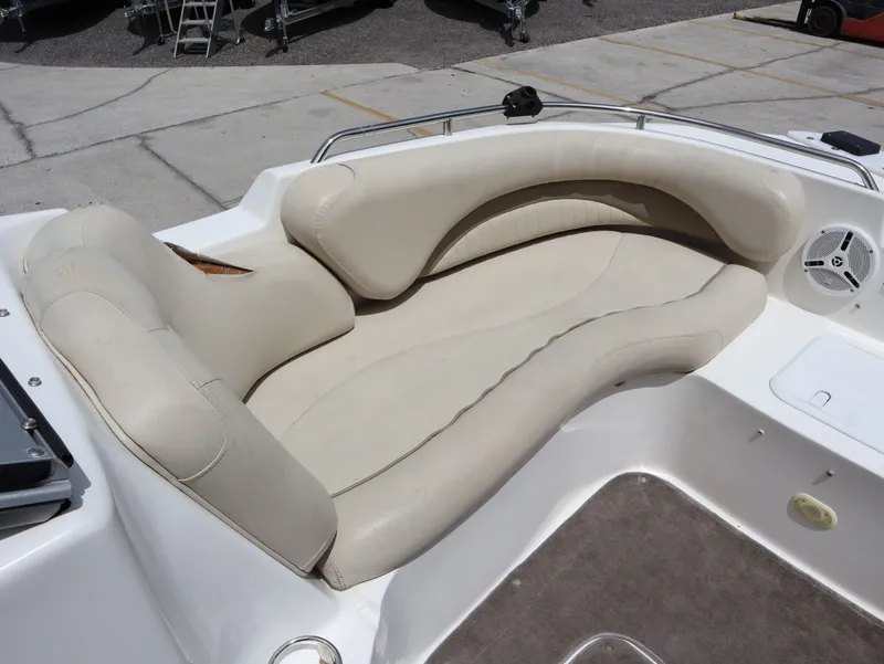 Slide: The Image of 2008 NauticStar 210 DC boat with beige seating area. - 18