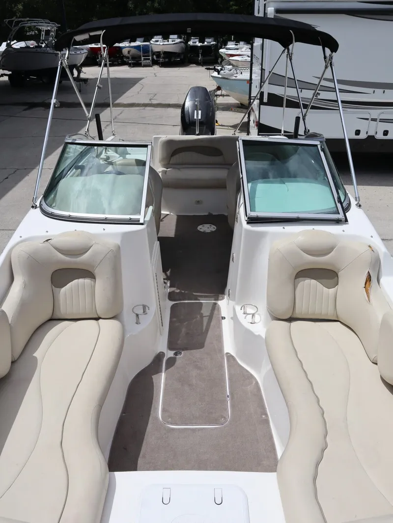 Slide: The Image of Interior view of a 2008 NauticStar 210 DC boat with beige seating. - 23