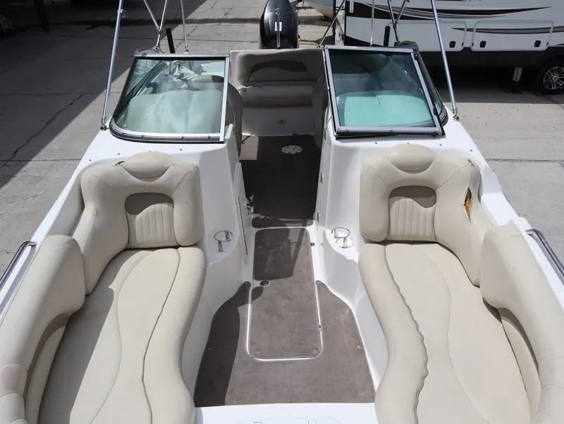 Slide: The Image of Interior view of a 2008 NauticStar 210 DC boat with beige seating. - 24