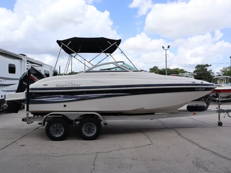 Slide: The Image of 2008 NauticStar 210 DC boat on trailer, side view. - 6