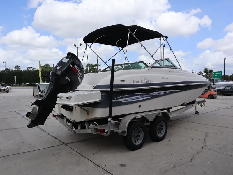 Slide: The Image of 2008 NauticStar 210 DC boat on trailer, Suzuki engine. - 7
