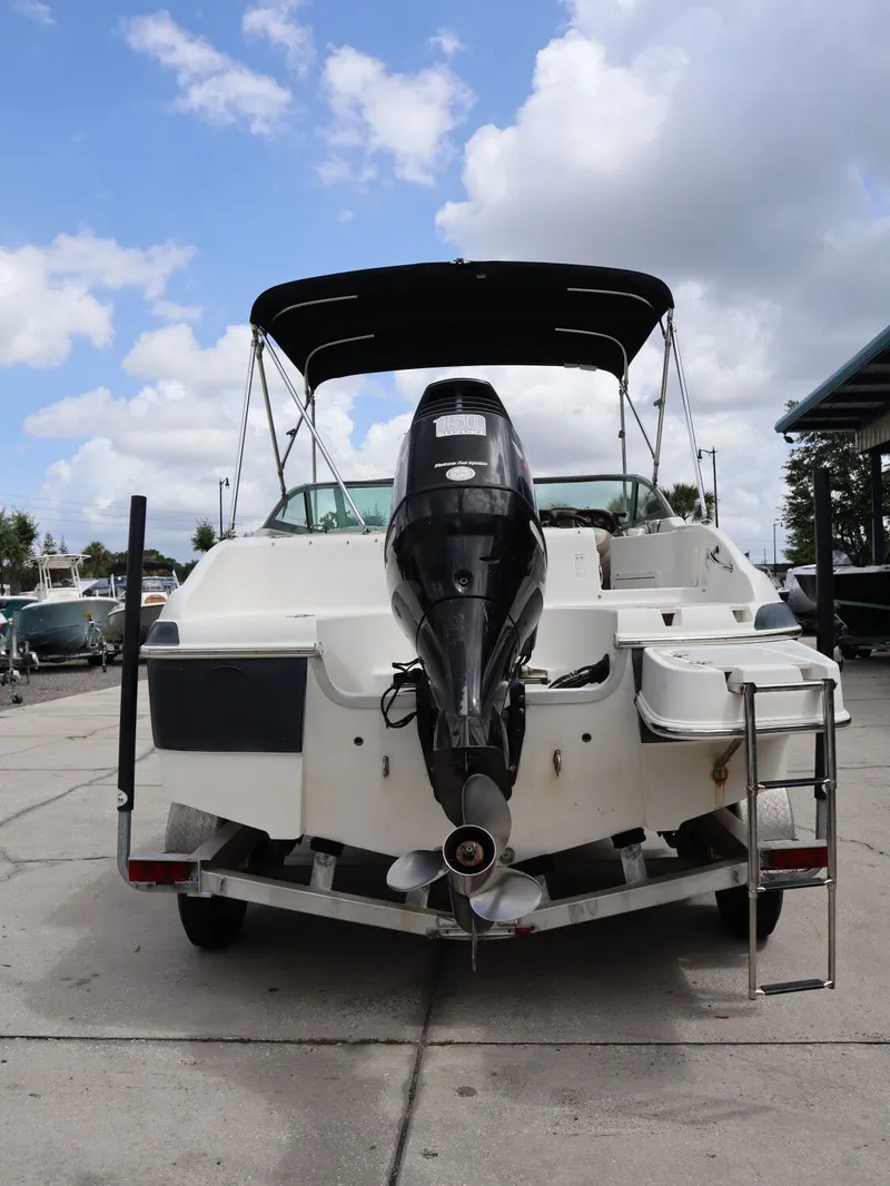 Slide: The Image of Rear view of a 2008 NauticStar 210 DC boat at the dock. - 8