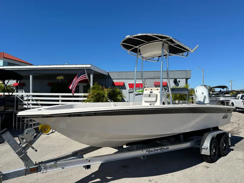 The Image of 2025 Carolina Skiff Sea Skiff 218 EV on trailer, parked outdoors. - 1