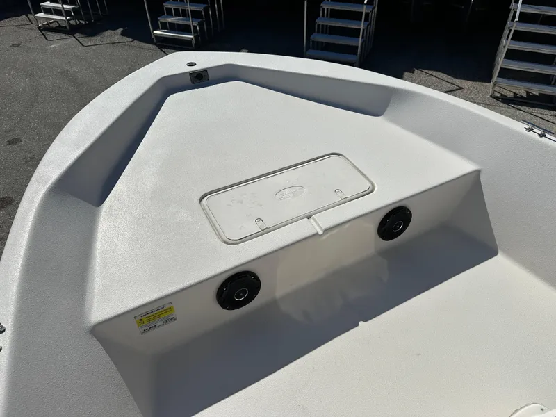 Slide: The Image of 2025 Carolina Skiff Sea Skiff 218 EV boat deck with storage compartment. - 15