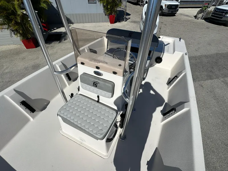 Slide: The Image of 2025 Carolina Skiff Sea Skiff 218 EV boat interior with seating and console. - 16