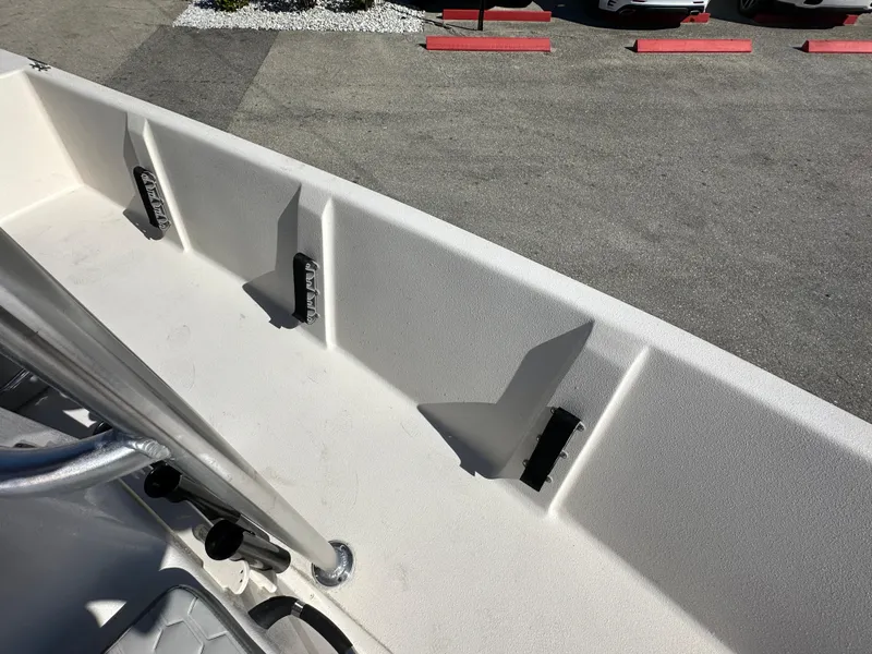 Slide: The Image of 2025 Carolina Skiff Sea Skiff 218 EV boat interior detail, showing seating and railing. - 18