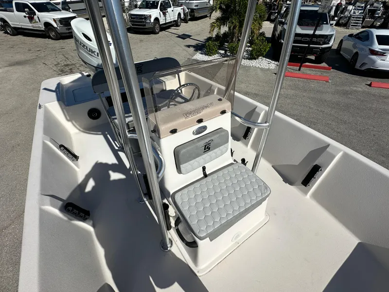Slide: The Image of 2025 Carolina Skiff Sea Skiff 218 EV boat interior with console and seating. - 19