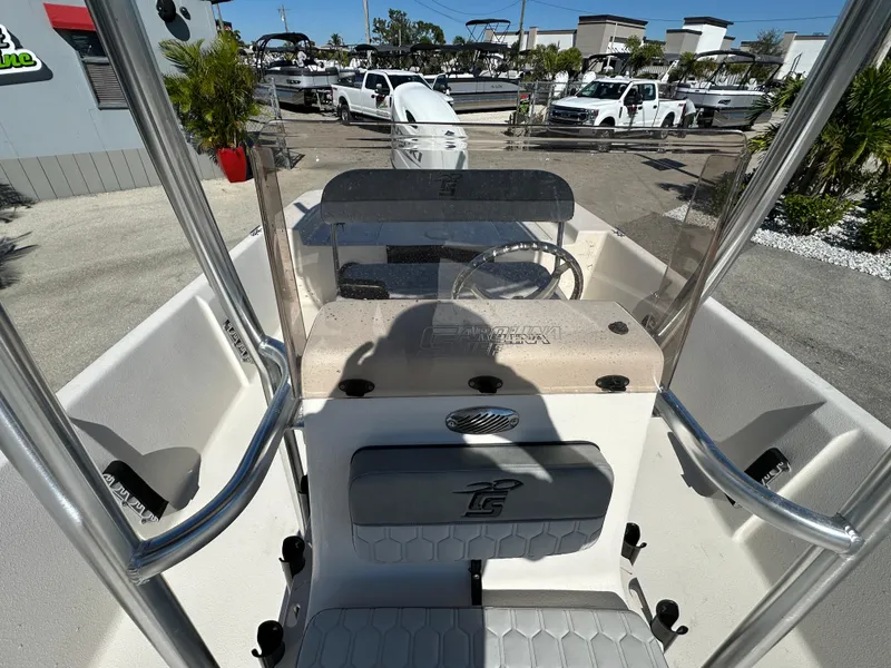 Slide: The Image of 2025 Carolina Skiff Sea Skiff 218 EV boat interior with steering console and seating. - 20