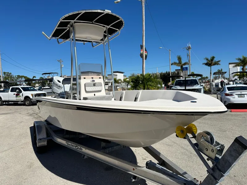 Slide: The Image of 2025 Carolina Skiff Sea Skiff 218 EV on trailer, outdoor dealership display. - 5