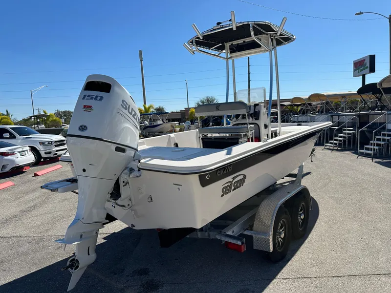 Slide: The Image of 2025 Carolina Skiff Sea Skiff 218 EV on trailer, featuring Suzuki outboard motor. - 8