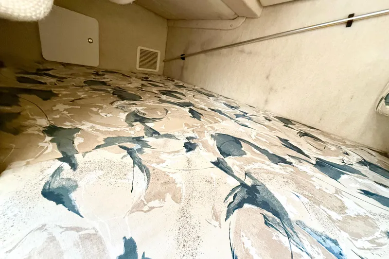 Slide: The Image of Interior cabin of 1999 Sea Ray Sundancer 260 with patterned upholstery. - 17