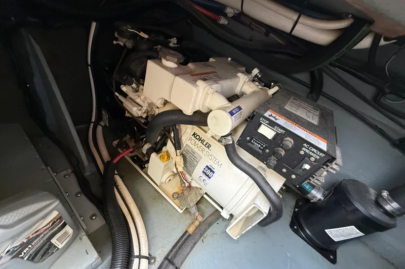 Slide: The Image of Engine compartment of a 1999 Sea Ray Sundancer 260 with Kohler power system. - 31