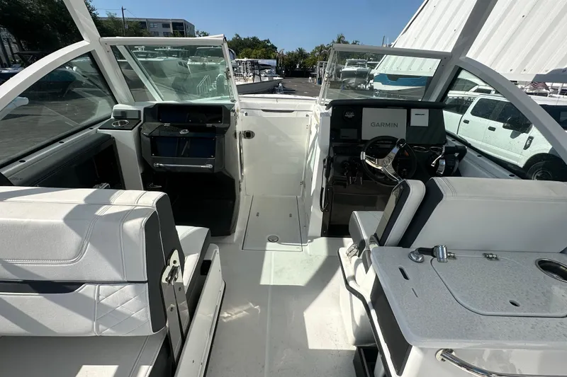 Slide: The Image of Interior view of 2021 Blackfin 252 DC boat with modern dashboard and seating. - 25