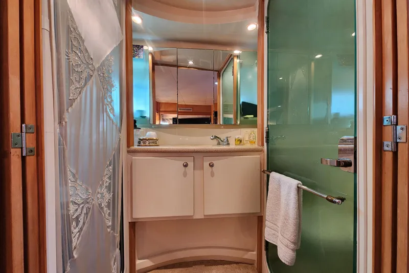 Slide: The Image of Luxurious bathroom in 1997 Carver 500 Cockpit Motor Yacht with elegant fixtures and decor. - 13