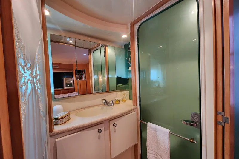 Slide: The Image of Bathroom interior of 1997 Carver 500 Cockpit Motor Yacht with frosted glass shower door. - 14