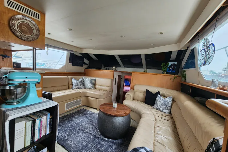 Slide: The Image of Luxurious interior of a 1997 Carver 500 Cockpit Motor Yacht with plush seating and modern decor. - 19
