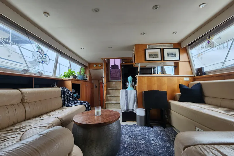 Slide: The Image of Luxurious interior of a 1997 Carver 500 Cockpit Motor Yacht with plush seating and decor. - 2