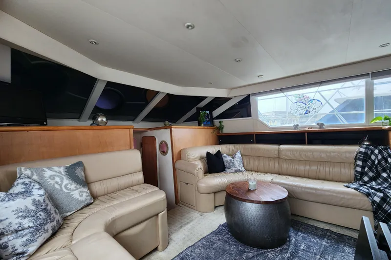 Slide: The Image of Luxurious interior of a 1997 Carver 500 Cockpit Motor Yacht with plush seating and decor. - 20