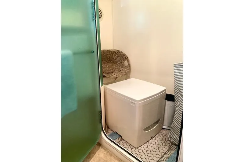 Slide: The Image of Bathroom interior of 1997 Carver 500 Cockpit Motor Yacht with modern toilet and decor. - 24