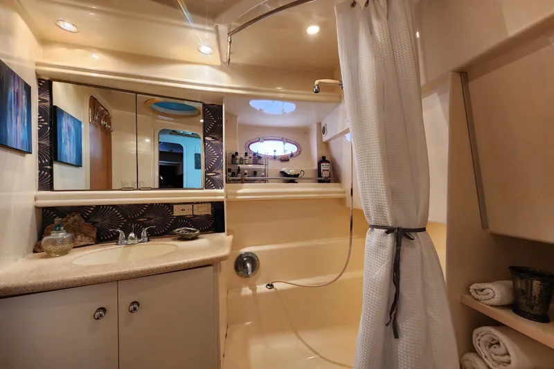 Slide: The Image of Luxurious bathroom in a 1997 Carver 500 Cockpit Motor Yacht with elegant fixtures. - 4
