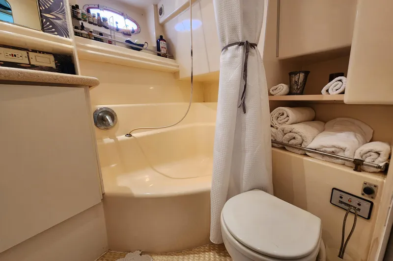 Slide: The Image of Bathroom interior of 1997 Carver 500 Cockpit Motor Yacht with shower and towels. - 5