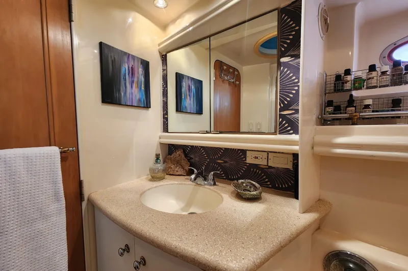 Slide: The Image of Luxurious bathroom in 1997 Carver 500 Cockpit Motor Yacht with elegant decor and modern amenities. - 6