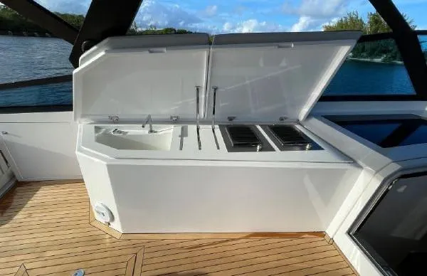 Slide: The Image of Outdoor kitchen on a 2017 Evo Yachts 43, featuring a sink and grill. - 15