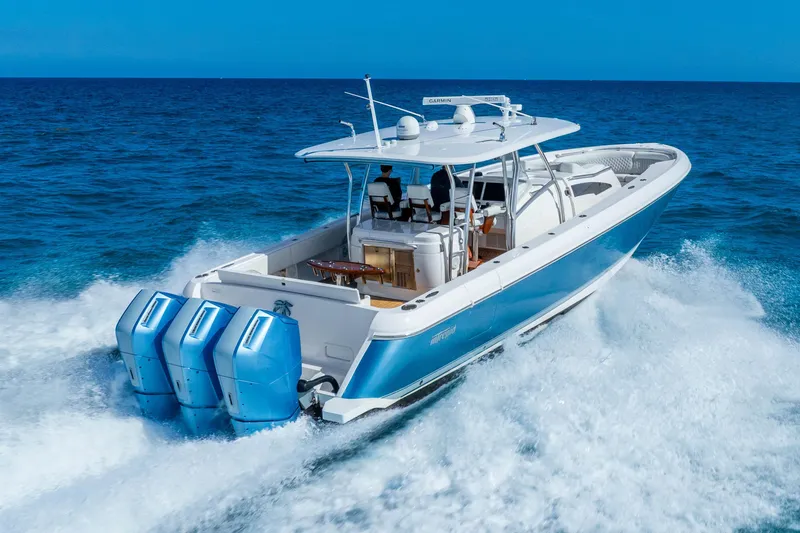 The Image of 2015 Intrepid 475 Panacea cruising on open ocean with powerful outboard engines. - 0