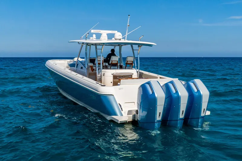 Slide: The Image of 2015 Intrepid 475 Panacea boat with four engines cruising on open sea. - 10