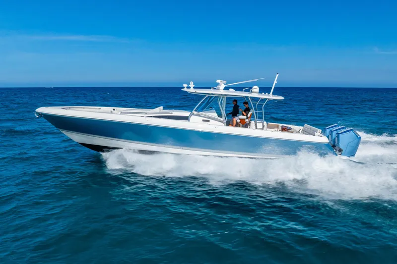 Slide: The Image of 2015 Intrepid 475 Panacea cruising on open ocean under clear blue sky. - 6