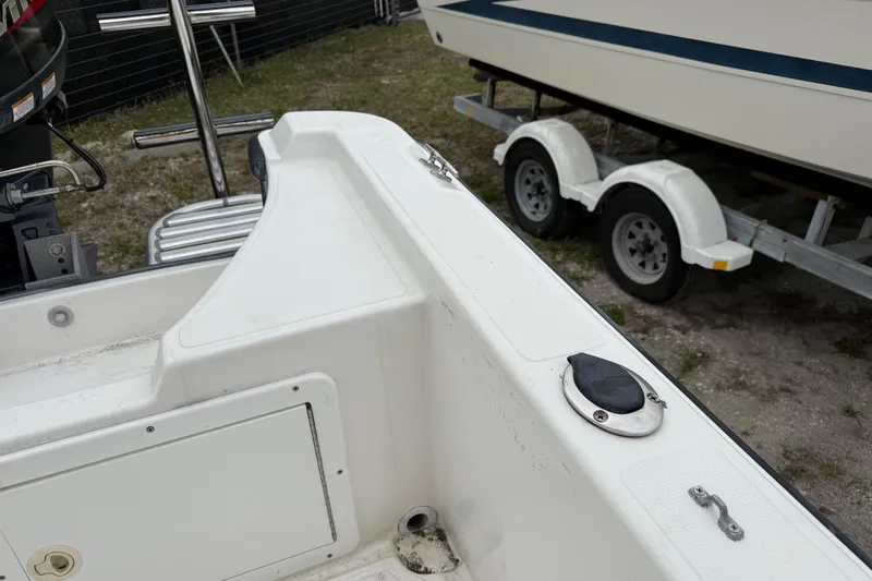 Slide: The Image of 2007 Panga 22LX boat interior with visible motor and trailer in background. - 12