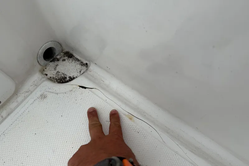 Slide: The Image of Close-up of a crack in a 2007 Panga 22LX boat's interior corner. - 14