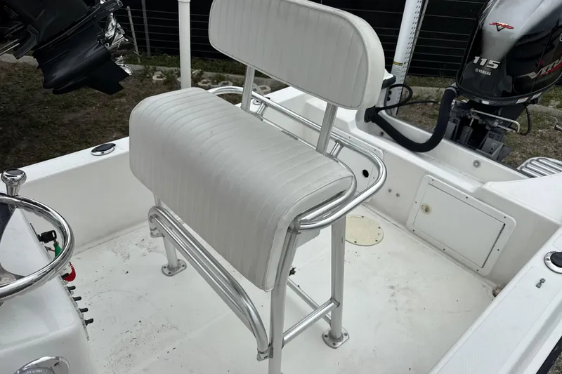 Slide: The Image of 2007 Panga 22LX boat interior with white seating and Yamaha 115 engine. - 18