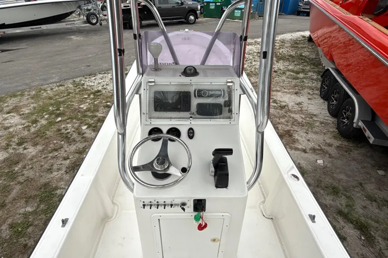 Slide: The Image of 2007 Panga 22LX boat console with steering wheel and controls, parked on a trailer. - 19