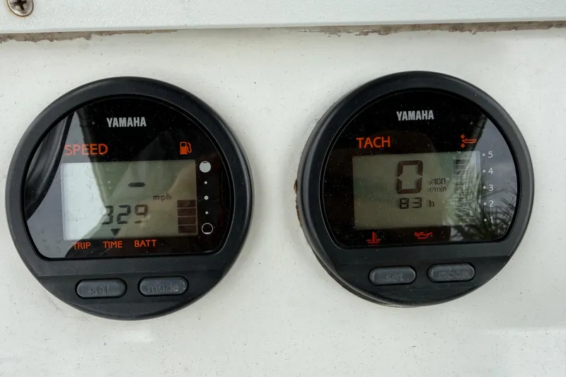 Slide: The Image of Yamaha speedometer and tachometer on a 2007 Panga 22LX boat dashboard. - 25