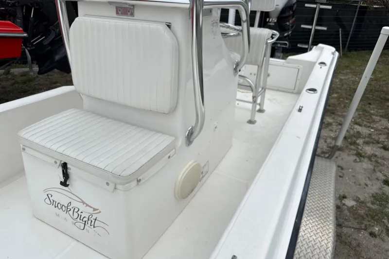 Slide: The Image of 2007 Panga 22LX boat interior with white seating and console. - 28