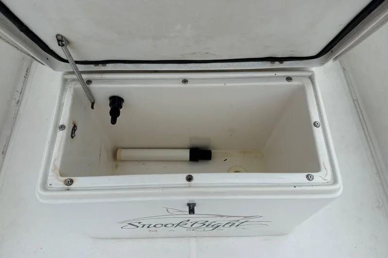 Slide: The Image of Open storage compartment on 2007 Panga 22LX boat, featuring Snook Bight Marine branding. - 29