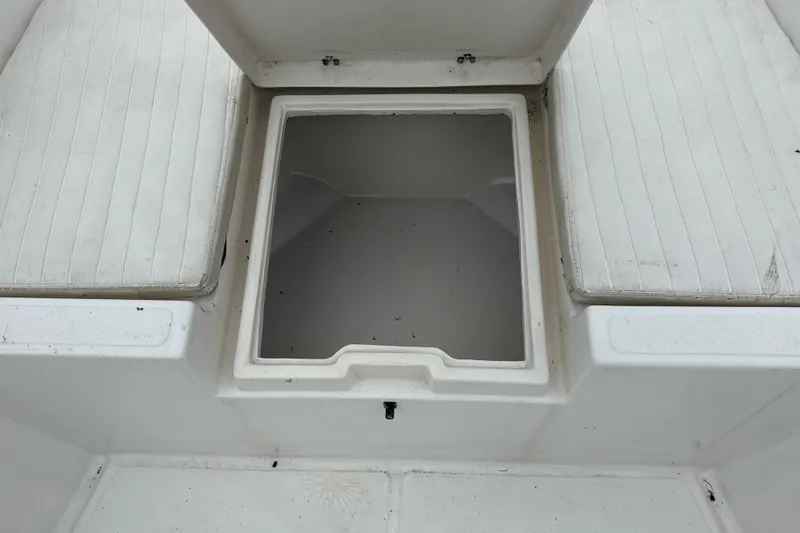 Slide: The Image of Open storage compartment on a 2007 Panga 22LX boat with cushioned seating. - 33
