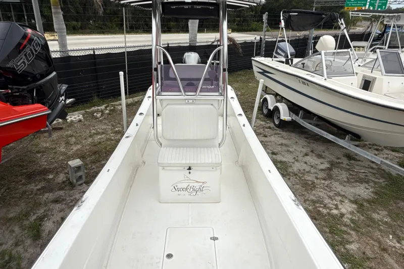 Slide: The Image of 2007 Panga 22LX boat with center console, parked on a trailer in a lot. - 35