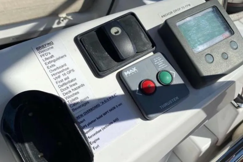 Slide: The Image of Control panel of a 2013 Jeanneau 57 yacht with navigation and thruster controls. - 20