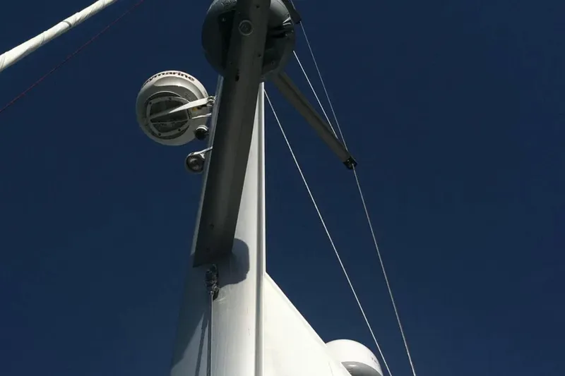 Slide: The Image of Mast and radar equipment on a 2013 Jeanneau 57 sailboat against a clear blue sky. - 24