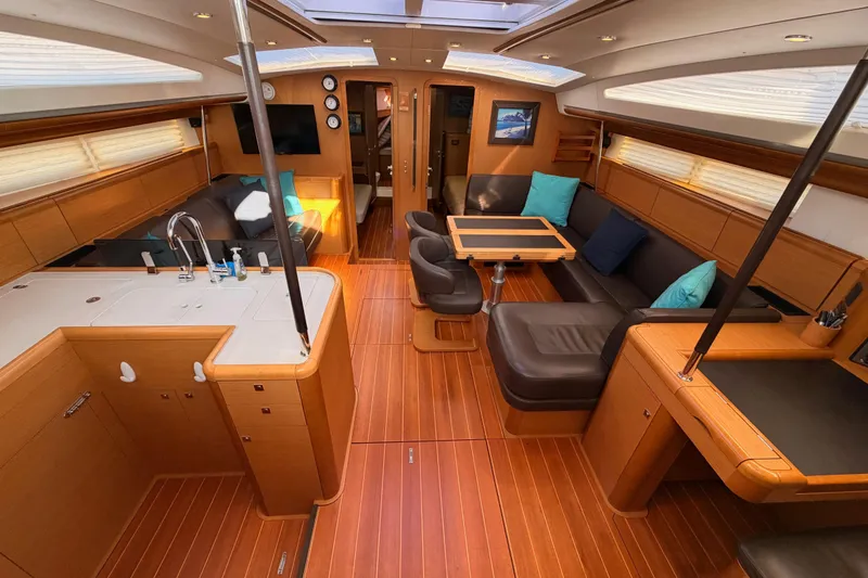 Slide: The Image of Luxurious interior of a 2013 Jeanneau 57 yacht with modern furnishings and wood finish. - 26