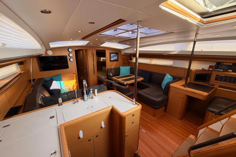 Slide: The Image of Luxurious interior of a 2013 Jeanneau 57 yacht with modern amenities and elegant design. - 34