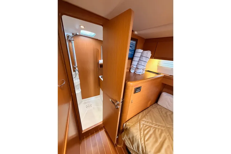 Slide: The Image of Interior of 2013 Jeanneau 57 yacht showing cozy cabin and bathroom. - 40