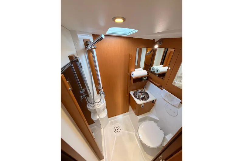 Slide: The Image of Luxurious bathroom in 2013 Jeanneau 57 yacht with modern fixtures and wooden accents. - 41