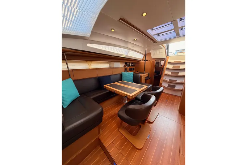 Slide: The Image of Luxurious interior of 2013 Jeanneau 57 yacht with elegant seating and wooden flooring. - 53