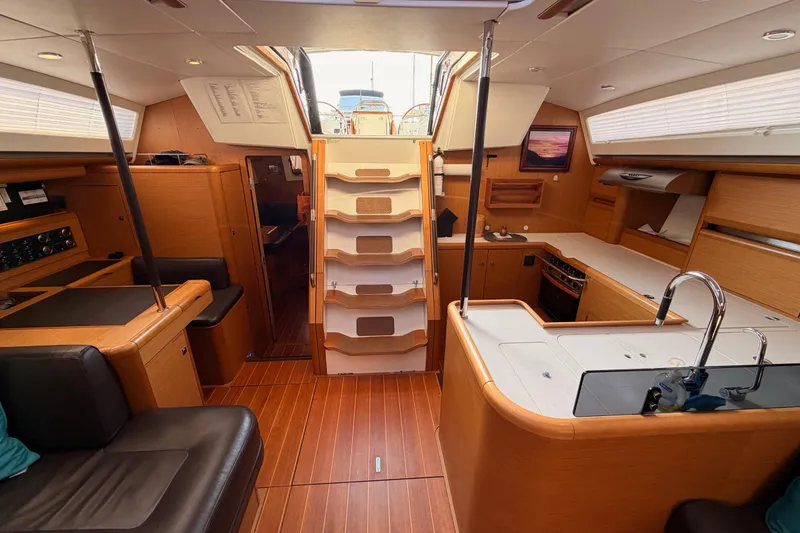 Slide: The Image of Luxurious interior of a 2013 Jeanneau 57 yacht with modern kitchen and seating area. - 55