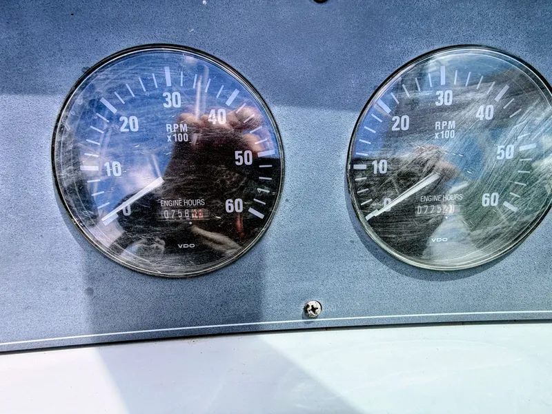 Slide: The Image of Two tachometers on a boat panel, displaying RPM and engine hours. - 6