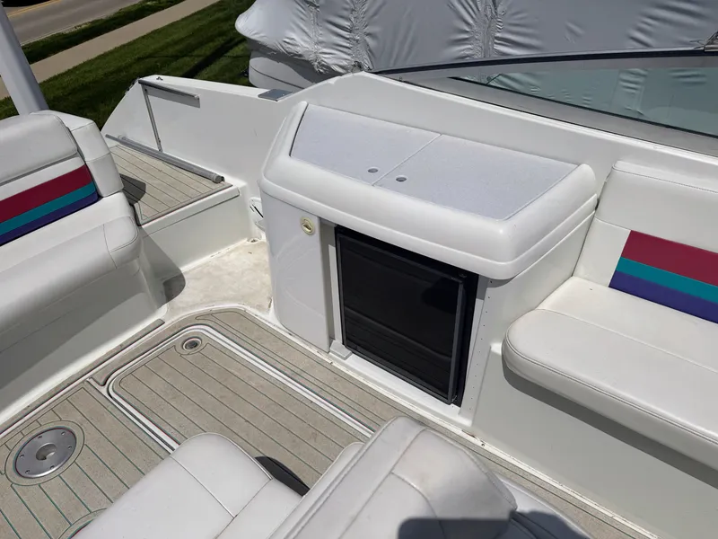 Slide: The Image of The boat features white seats with colorful stripes and a small compartment. - 7